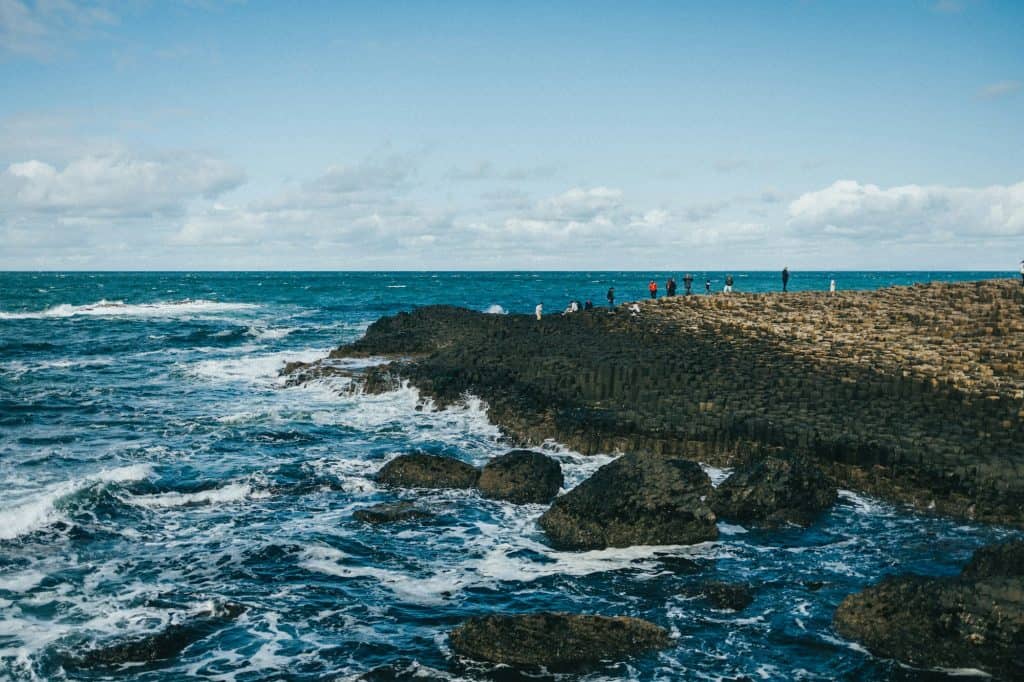 A group of people on a rocky beach