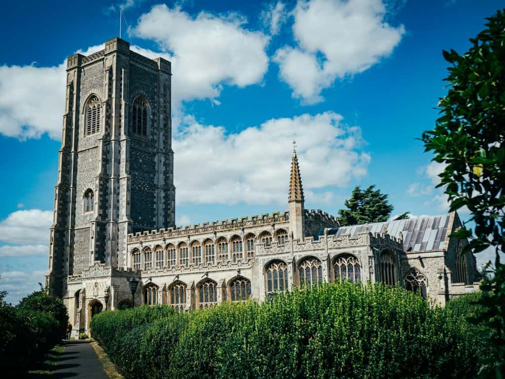 A very tall building with a clock on its side