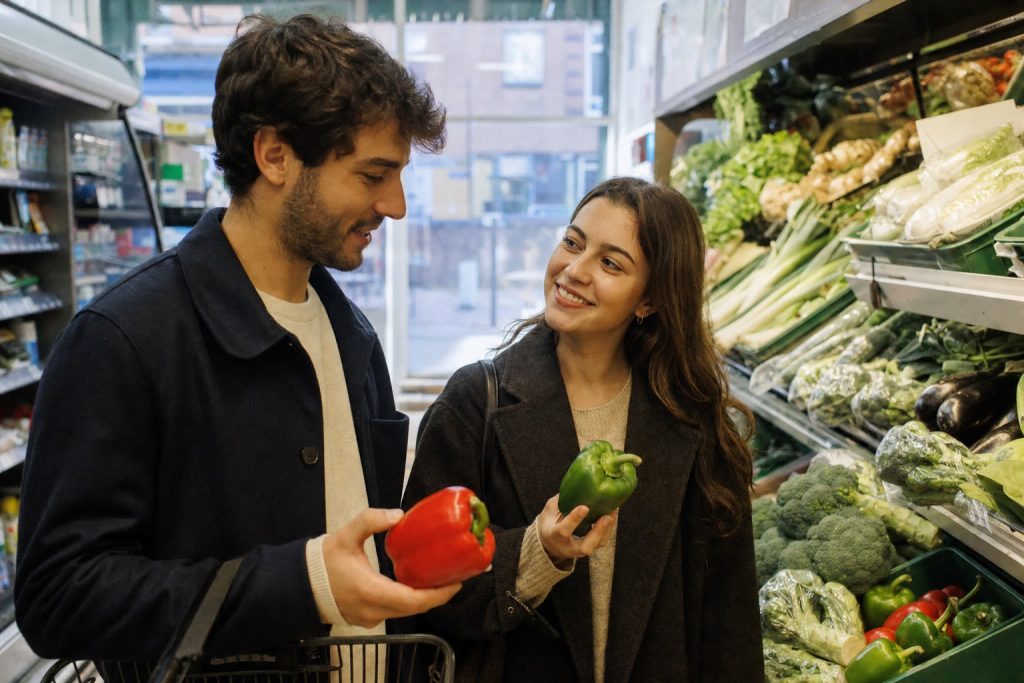Two students doing a weekly food shop in a London supermarket