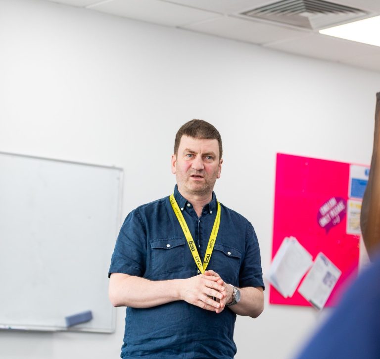 Teacher at the whiteboard at NCG Liverpool