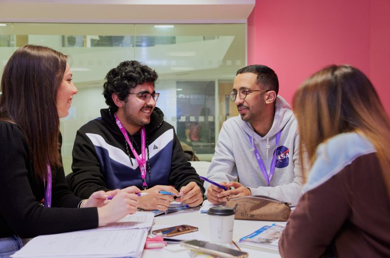 Students working together in class at NCG Manchester