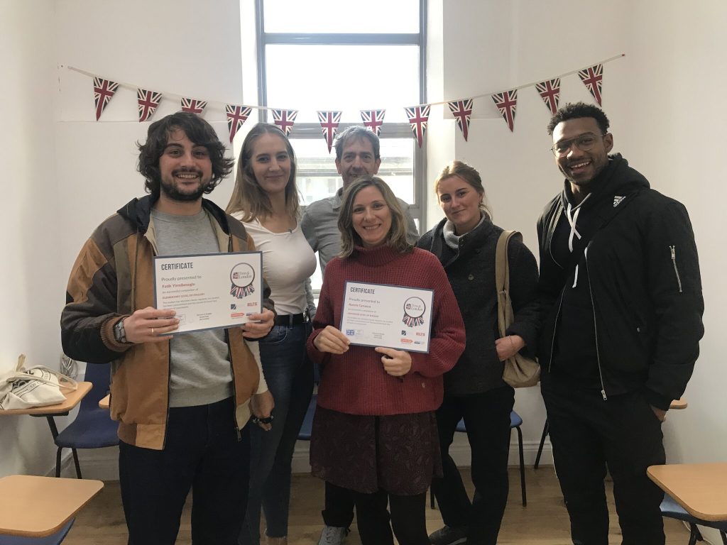 Time4London students holding their course certificates